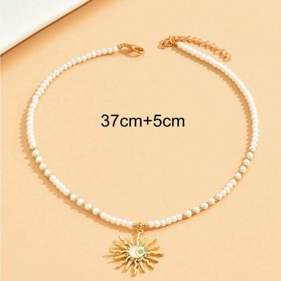 Anthropologie Gold and beaded White Necklace with Sunburst Pendant summer 2025 - Picture 3 of 4